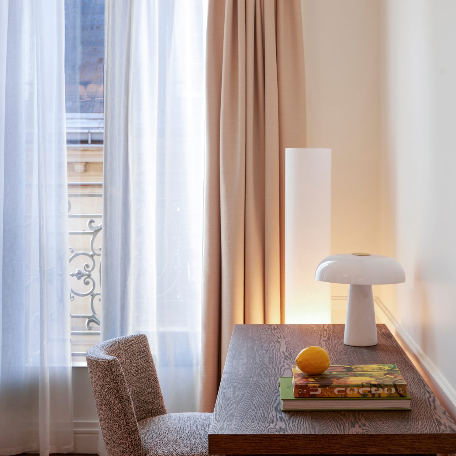 a wooden desk in the deluxe room at maison delano paris