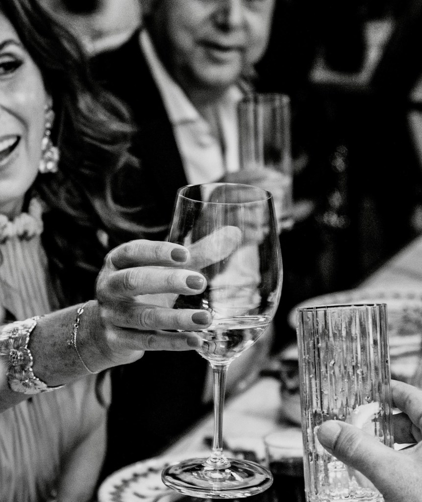 new years eve delano cafe at maison delano paris.  Joyful guests raising their glasses to the new year