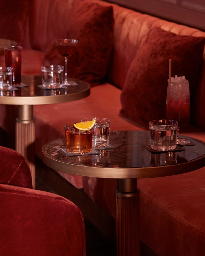 velvet seating at delano bar with cocktails on the table