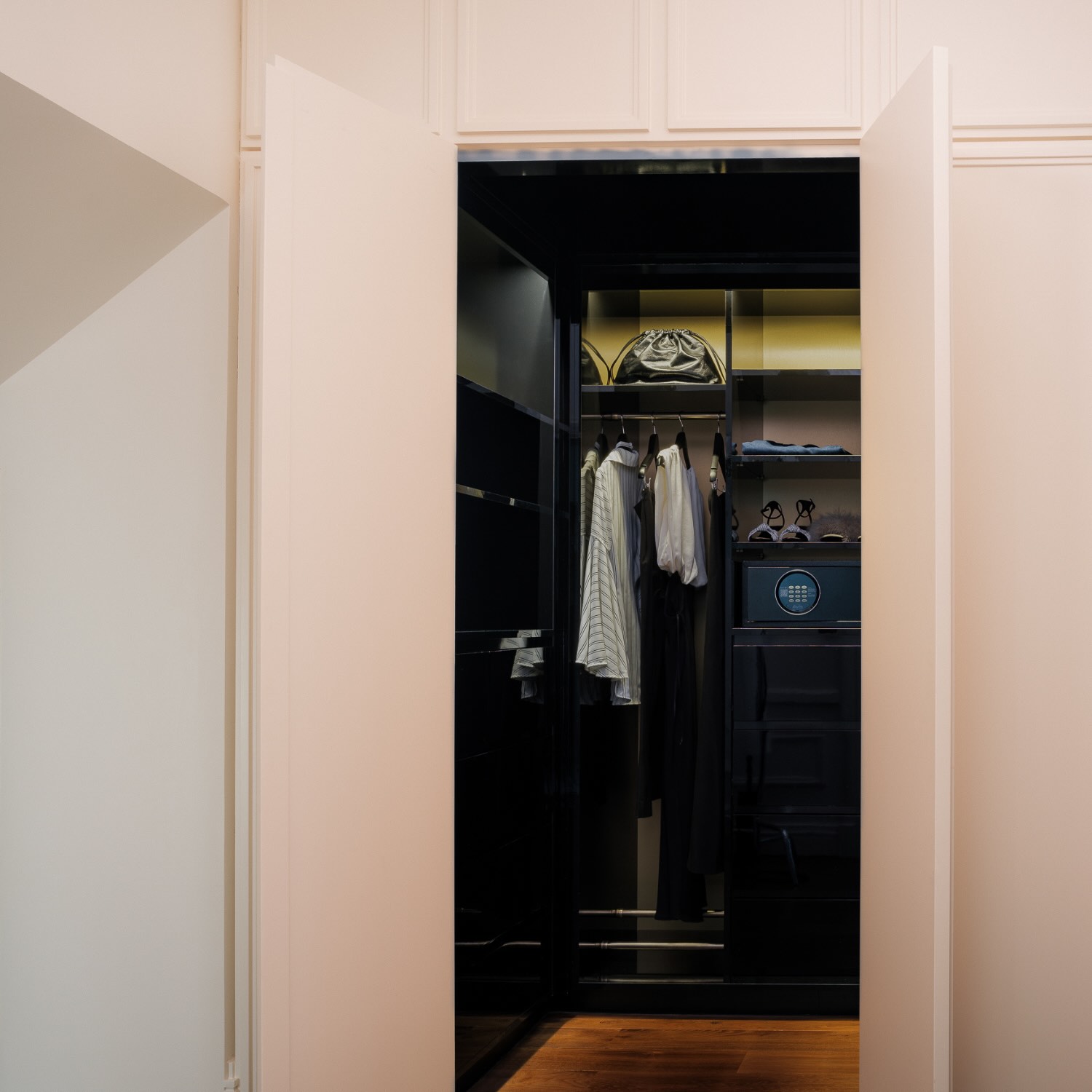 a large closet within the deluxe suite at maison delano paris