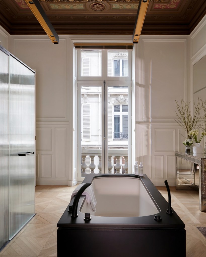 a soaking tub in a luxurious parisian bathroom