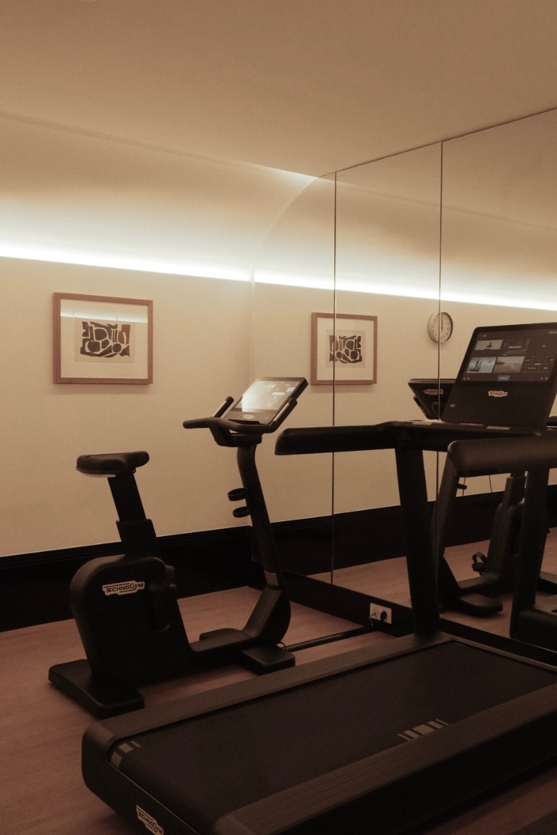 a treadmill and bike at the fitness center in maison delano paris