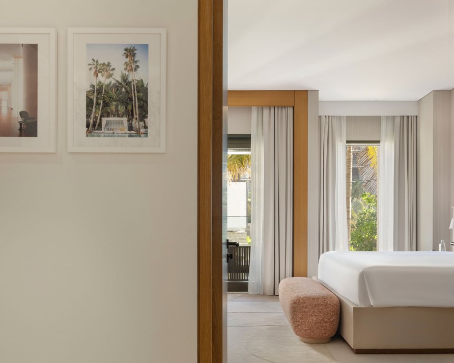 a peek through to a bedroom from a hallway