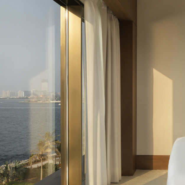 floor to ceiling windows with views of the sea