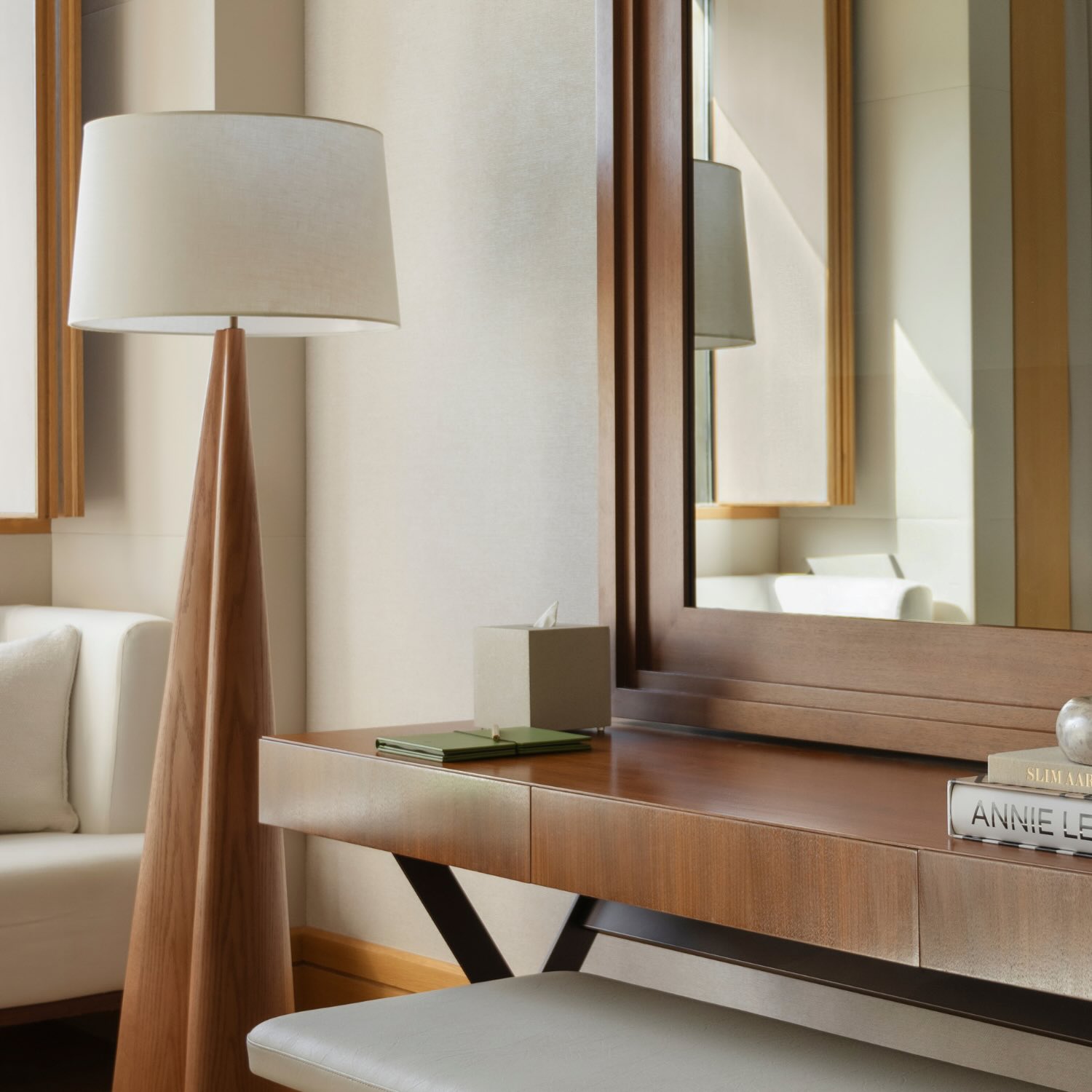 a desk in the rising light guestroom with a large mirror