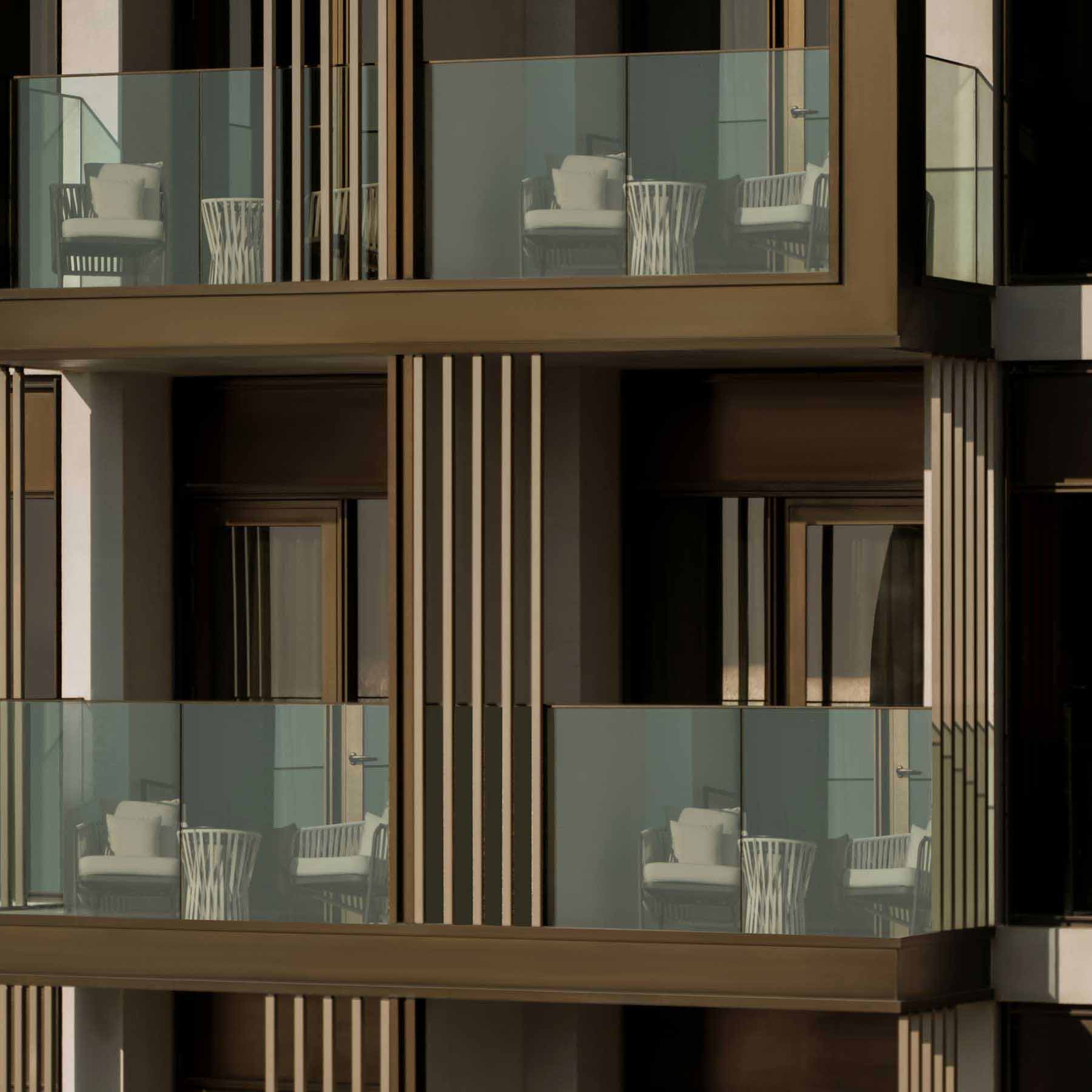 an outside view of the balcony of multiple rooms