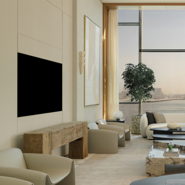 a large living space with a tv on the wall