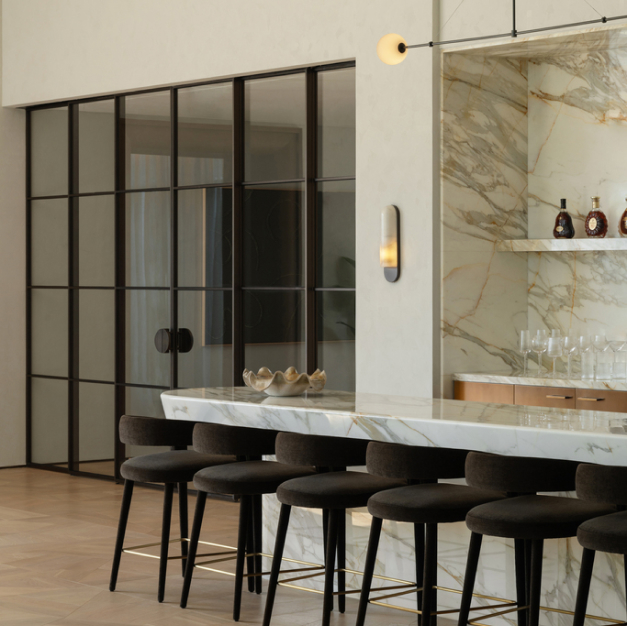 bar seating with glass doors entering another room