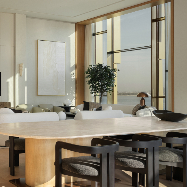 a dining room table with black chairs