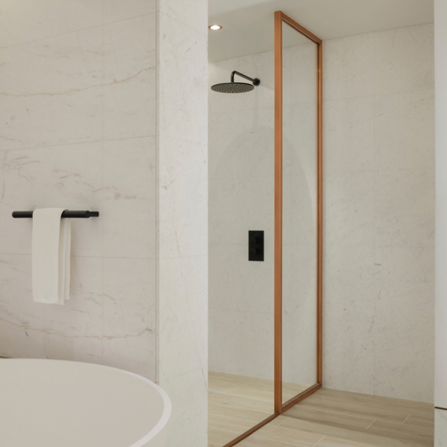 a white marble bathroom with a separate shower and bathtub