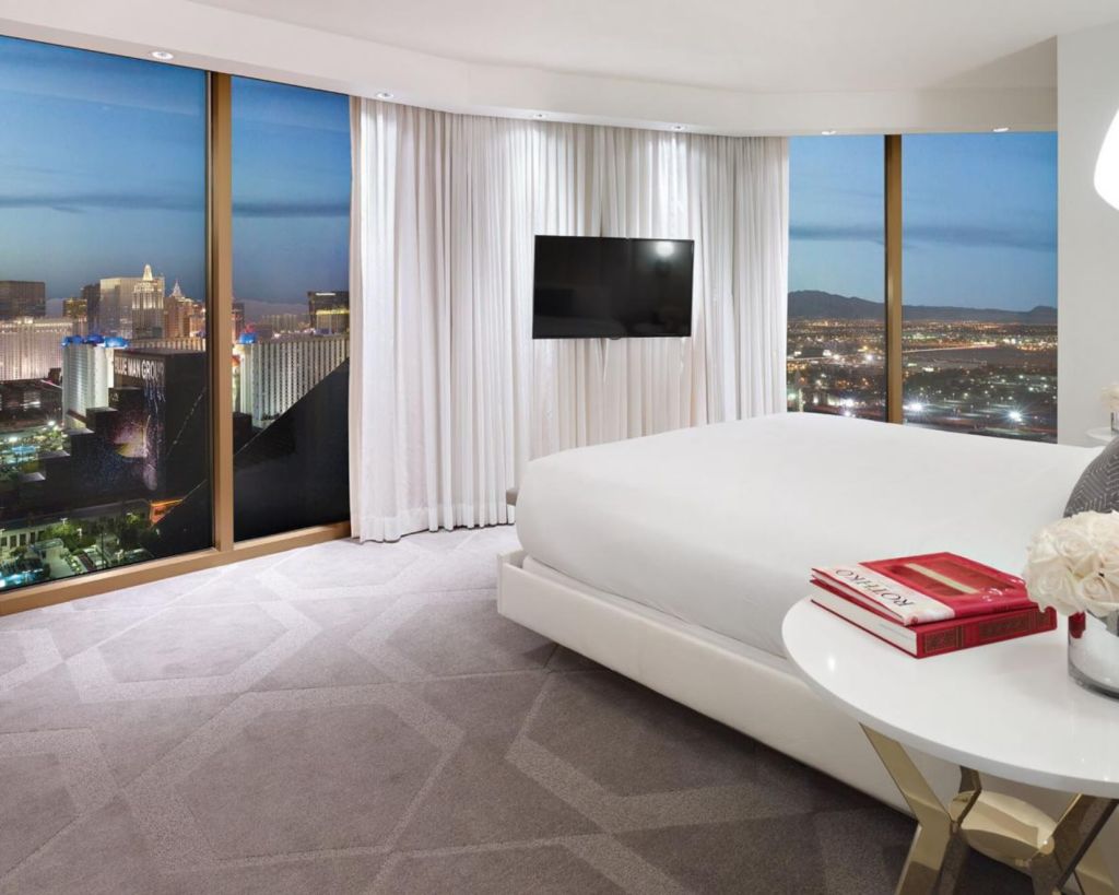 a room at delano las vegas with a king bed and views of the strip