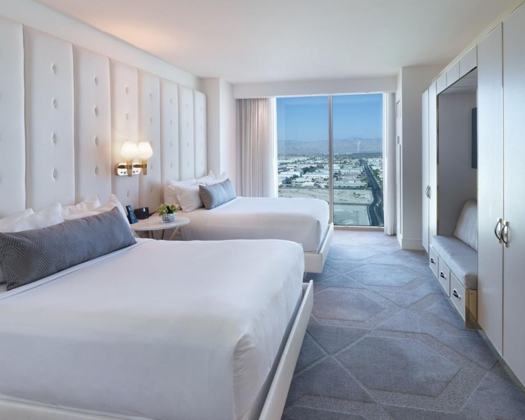 a room at delano las vegas with two queen beds