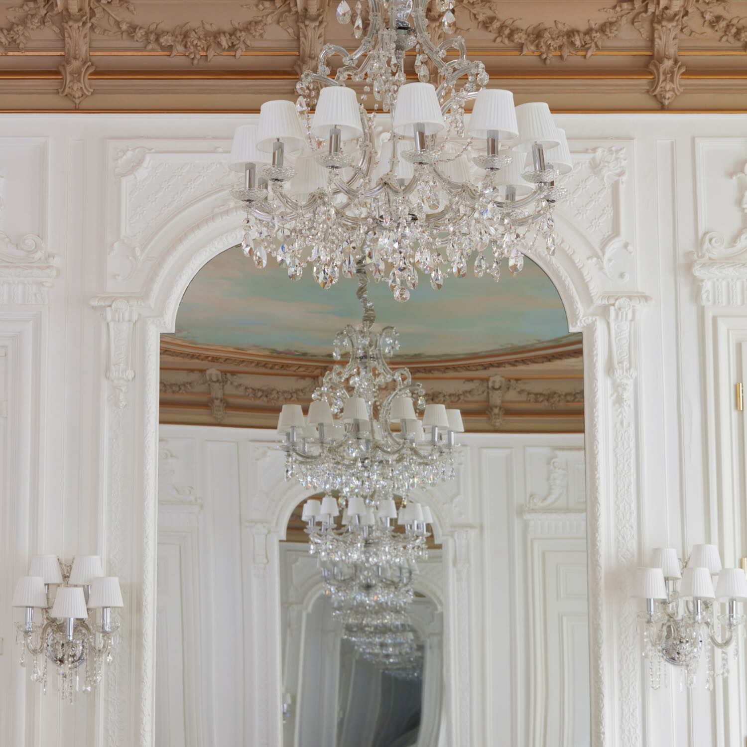 ornate glass chandelier and beautiful high ceilings