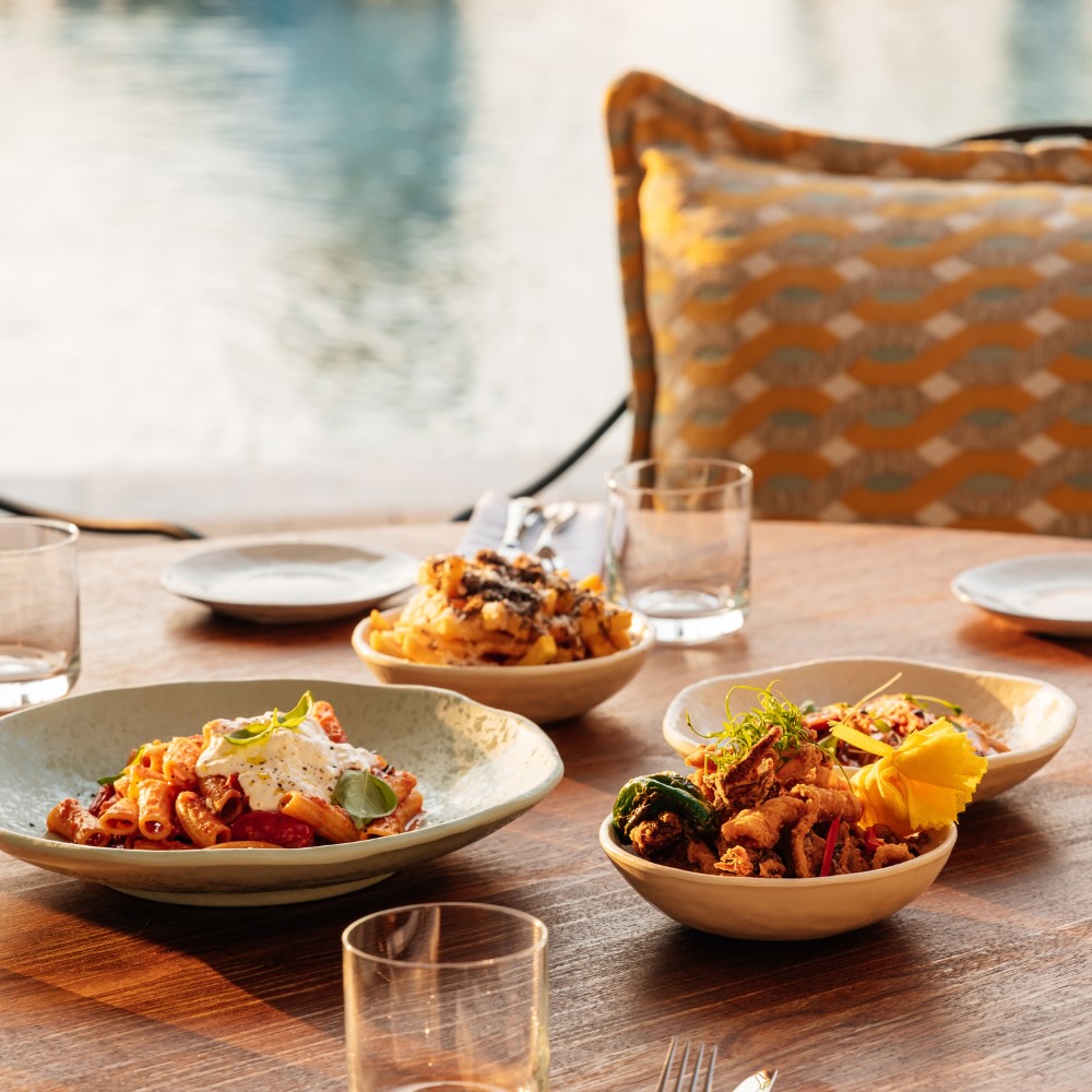 Arrabbiata Rigatoni dish served on a wood table 