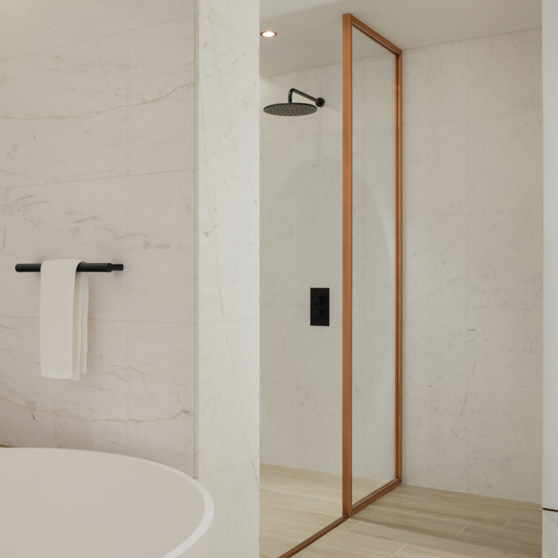 Minimalist bathroom featuring a walk-in shower with a copper-framed glass partition, a black rainfall showerhead, and sleek black fixtures. White marble walls contrast with light wood-look flooring, while a towel hangs on a black rail, creating a modern and elegant design.