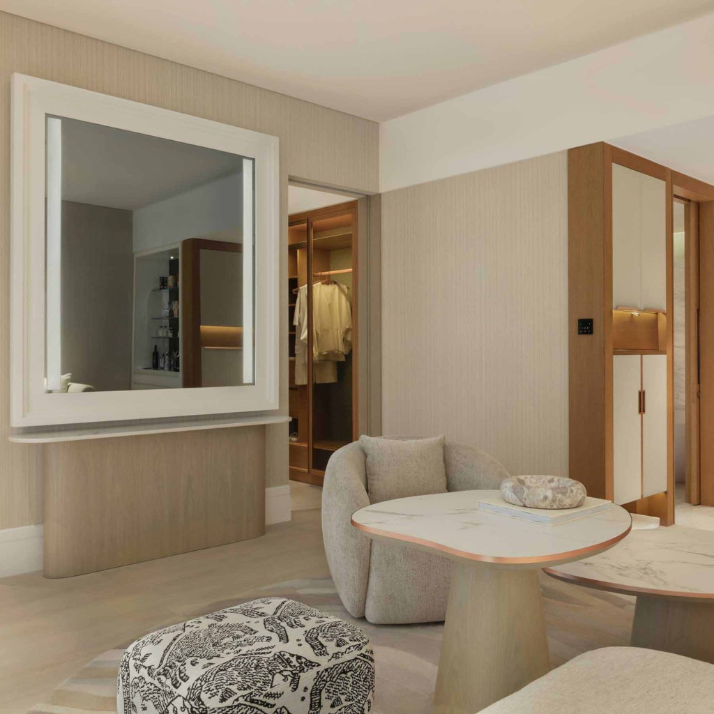 a living space with a chair, and plenty of seating